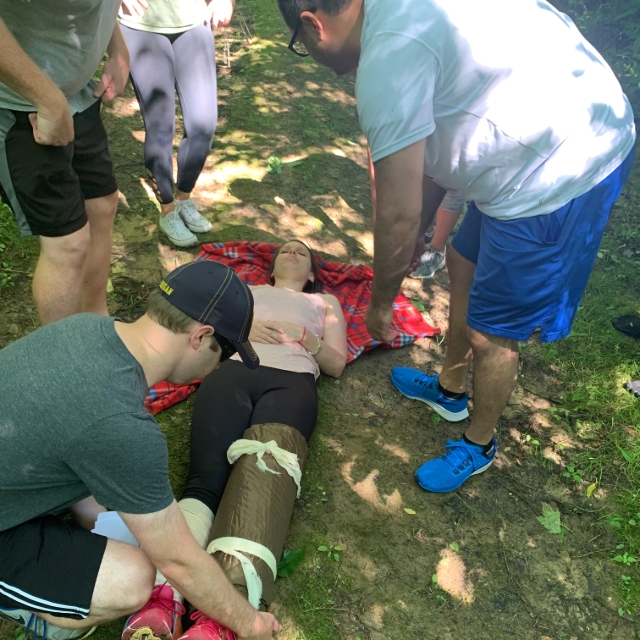 Residents participating in an outdoor group training activity with other residents