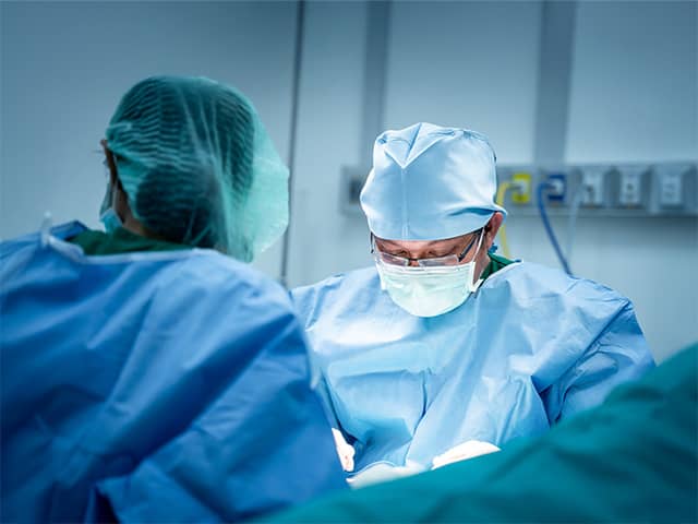 Doctor and medical staff in a surgery room performing a surgery