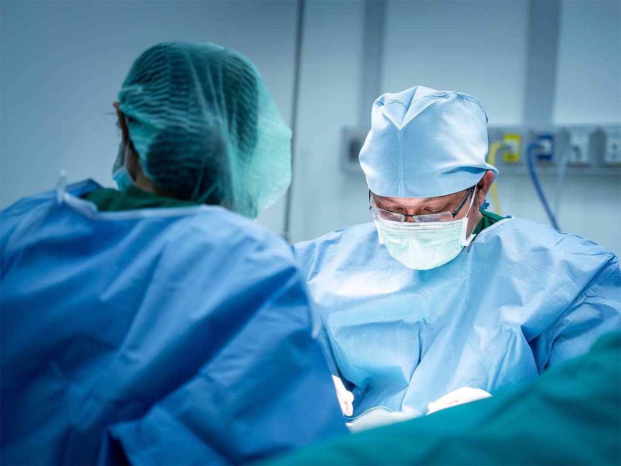 Corewell Health neurosurgeon performs a procedure in the operating room