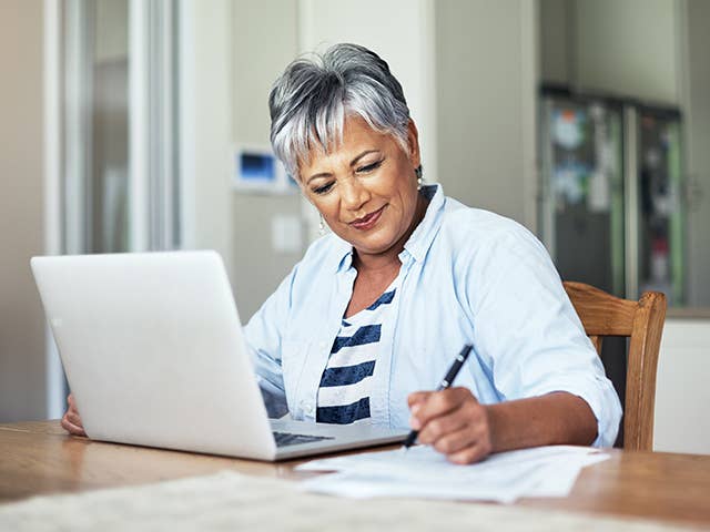 Woman on computer pays a medical bill