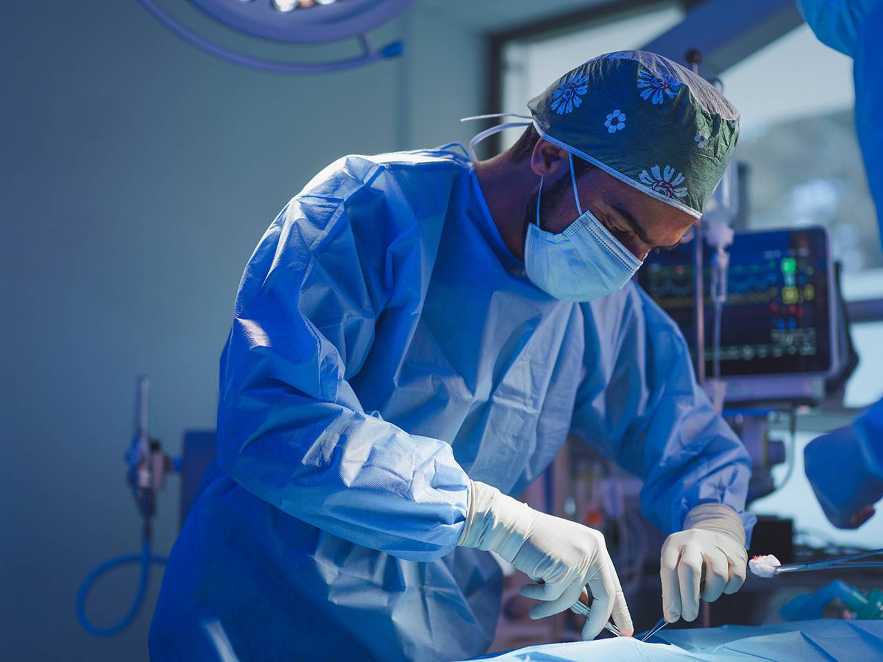 Surgery in the operating room performing a surgical procedure on a patient