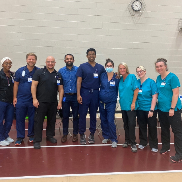 medical staff posing for a picture after they high school physical clinic