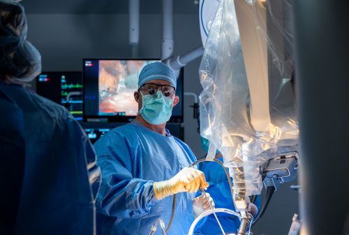 Doctor dressed in scrubs performing surgery