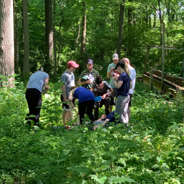 Residents participating in an outdoor training activity with fellow residents