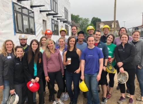 Group shot of 2019 residents and faculty participating in a Habitat for Humanity project