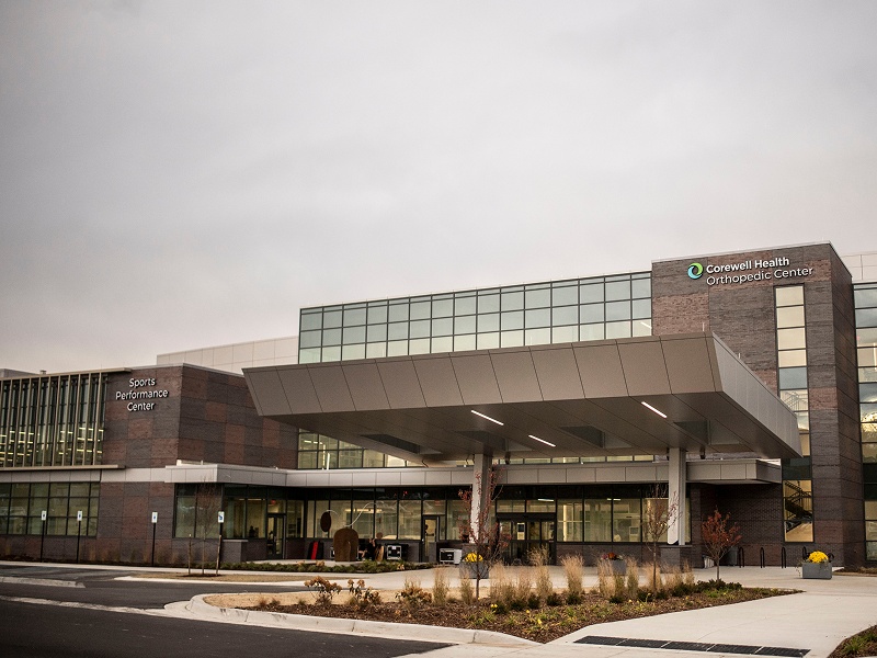 Corewell Health hospital building showcasing modern architecture and facilities for advanced medical training.
