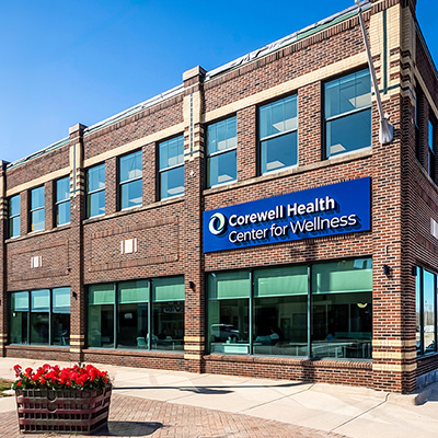 Front view of a building featuring a sign that reads "Crowell Health Center for Wellness"