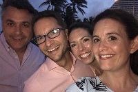 A group of faculty members from Graduate Medical Education in Southeast Michigan smiling and taking a selfie together.