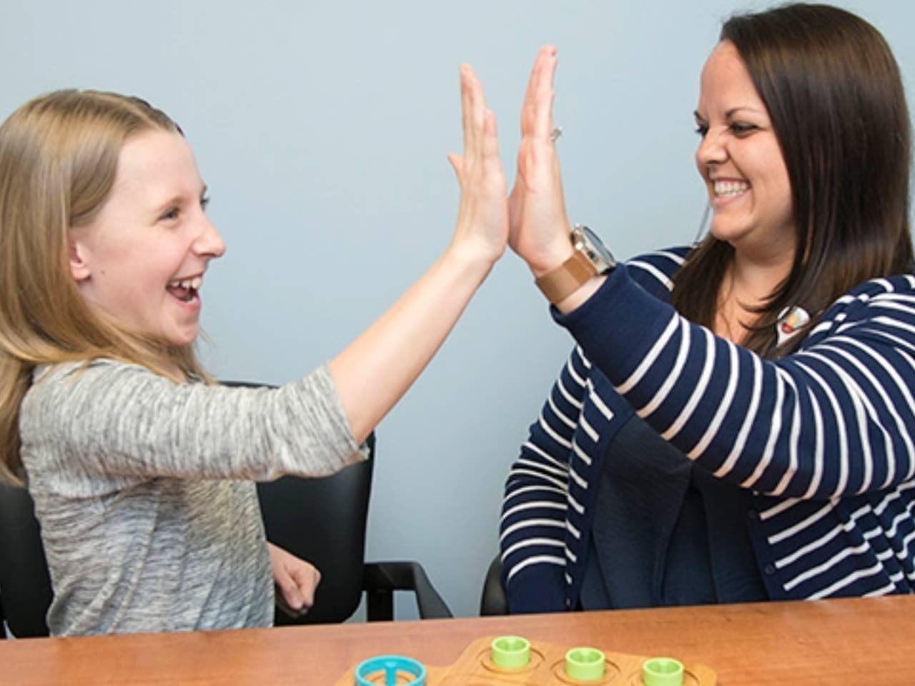 Staff member of the center interacting with a child.