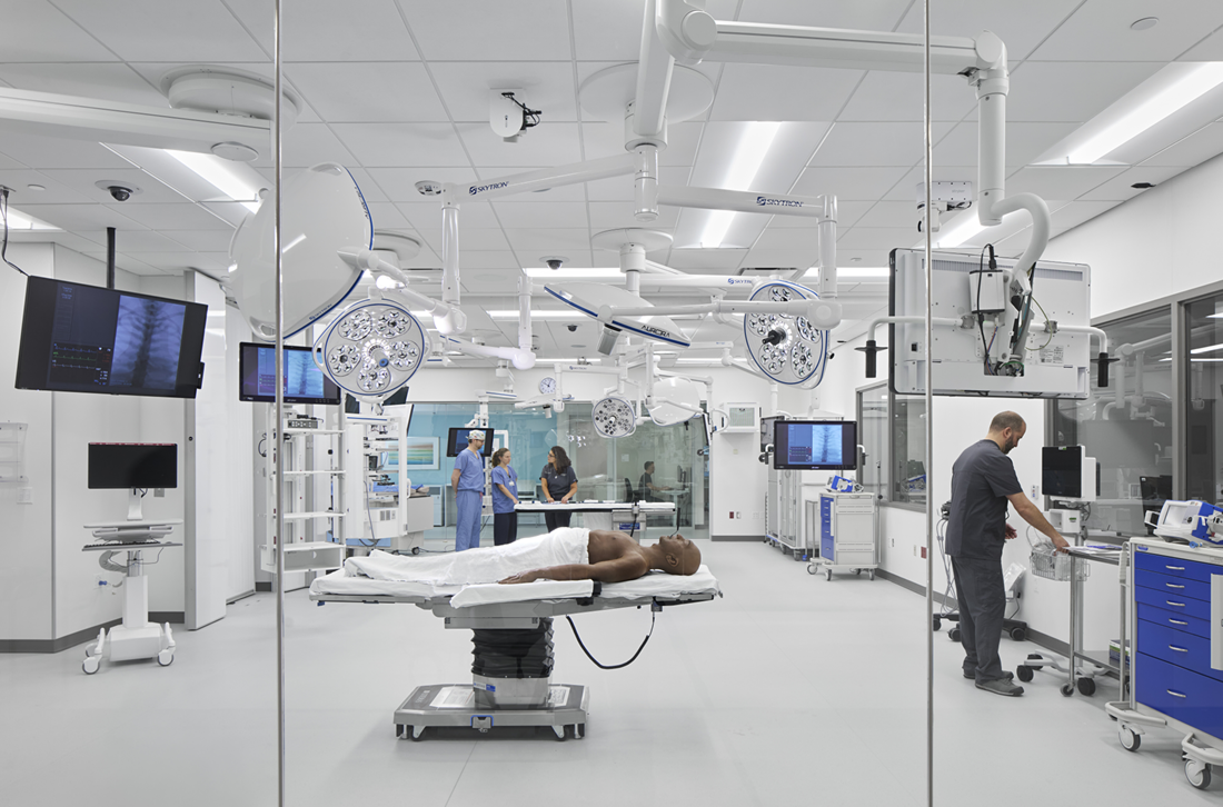 A hospital room featuring a bed, medical equipment, and a clean, sterile environment for patient care.
