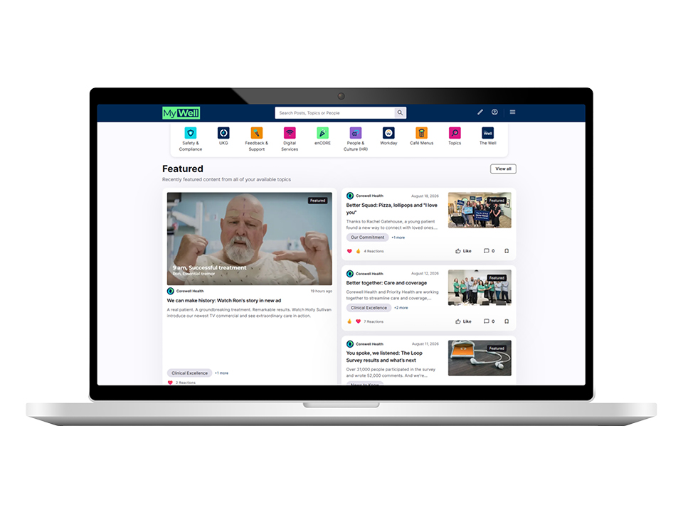 Laptop displaying the My Well employee wellness portal with featured Corewell Health news, resources and navigation tools.
