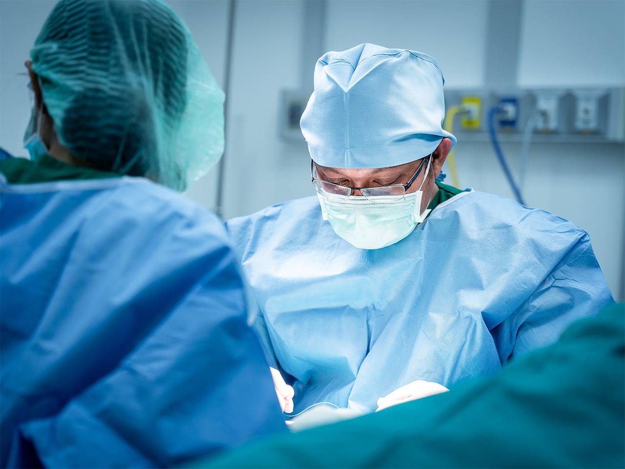 Surgeons in the operating room doing a spine surgery 