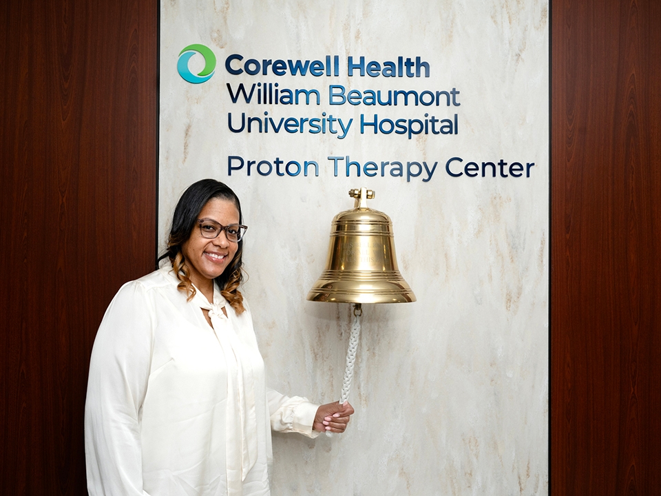 Patient ringing bell at Corwell Health William Beaumont University Hospital Proton Therapy Center.