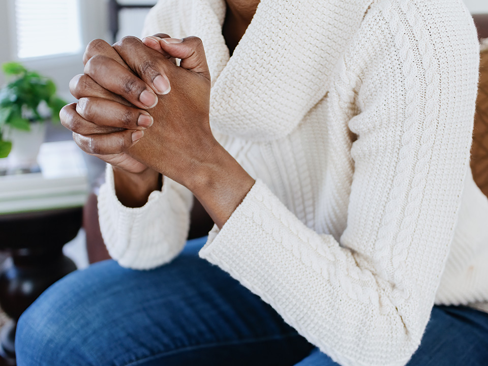 Female in the hospital chapel praying