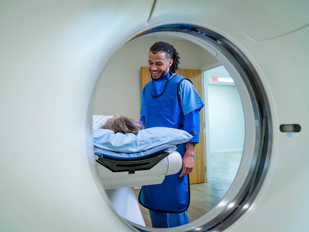 Woman lies down inside an MRI machine getting cardiovascular imaging done