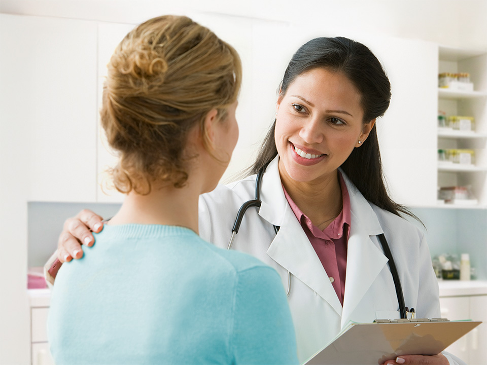 female doctor speaking to a patient at an appointment