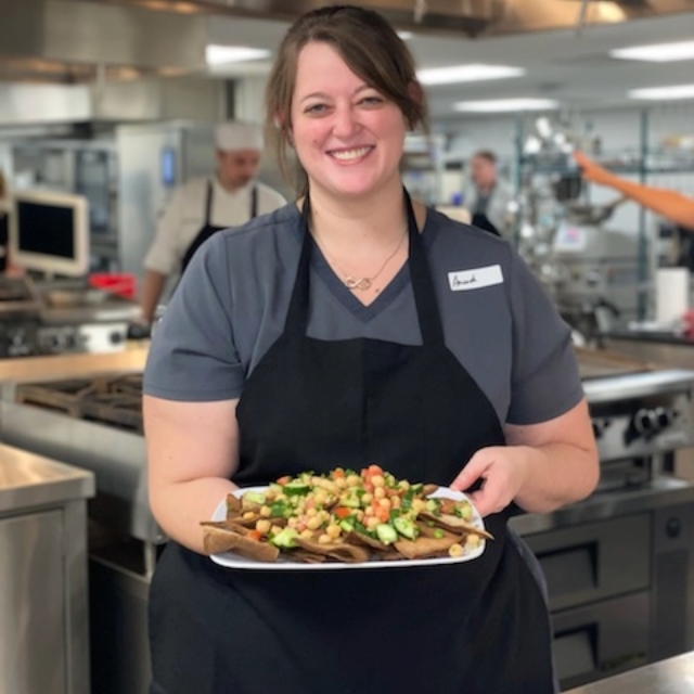 female chef showcasing a meal she made