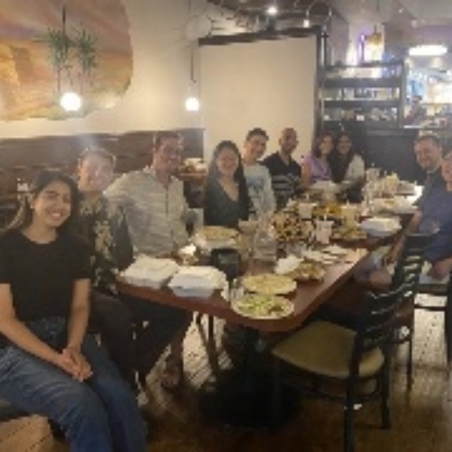 Group of senior residents celebrating with dinner and drinks