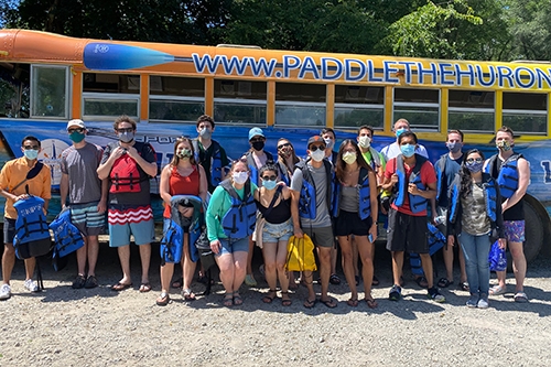 The blue and orange bus at the PGY 2 Wellness Retreat, representing a commitment to wellness and future residency steps.