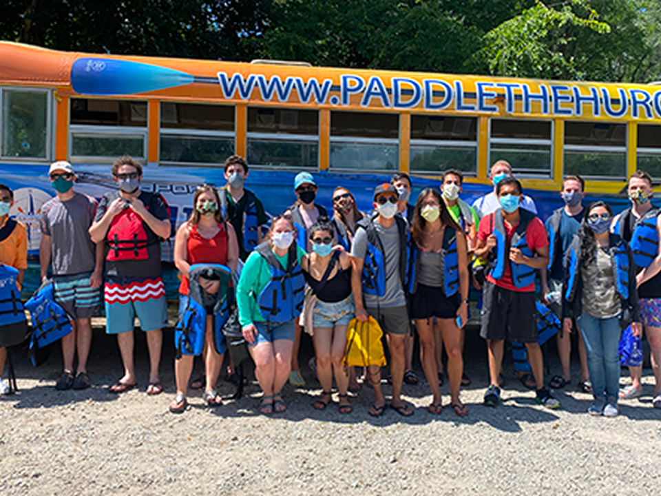 The blue and orange bus at the PGY 2 Wellness Retreat, representing a commitment to wellness and future residency steps.