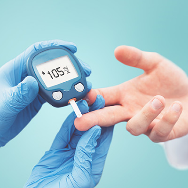 medical staff testing a person's blood sugar levels