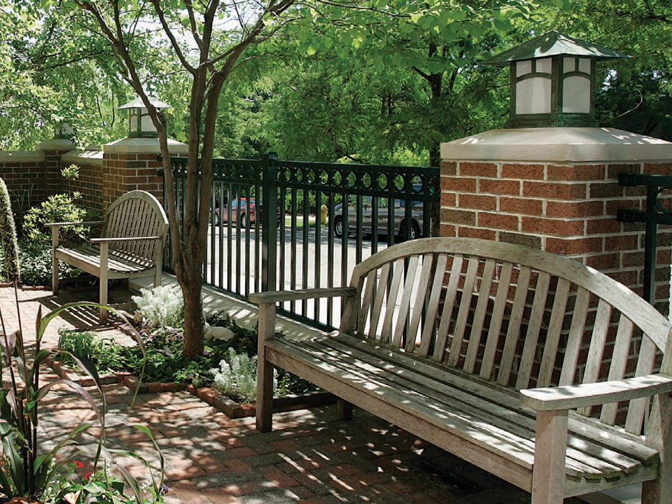 Outdoor bench in the gardens of Renucci Hospitality House.