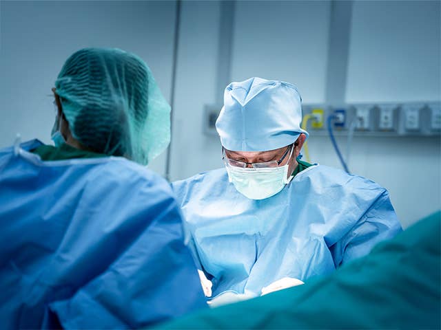 Corewell Health neurosurgeon performs a procedure in the operating room