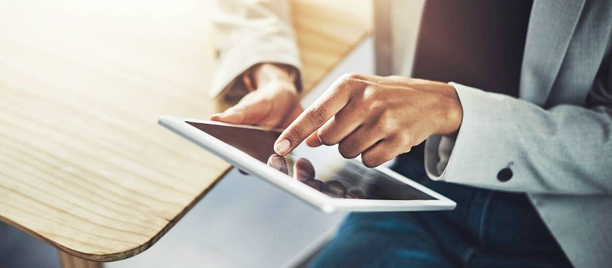 Woman with mobile device uses Corewell Health App to access MyChart
