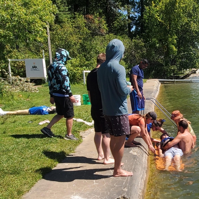 Residents participating and observing a water rescue situation during the retreat