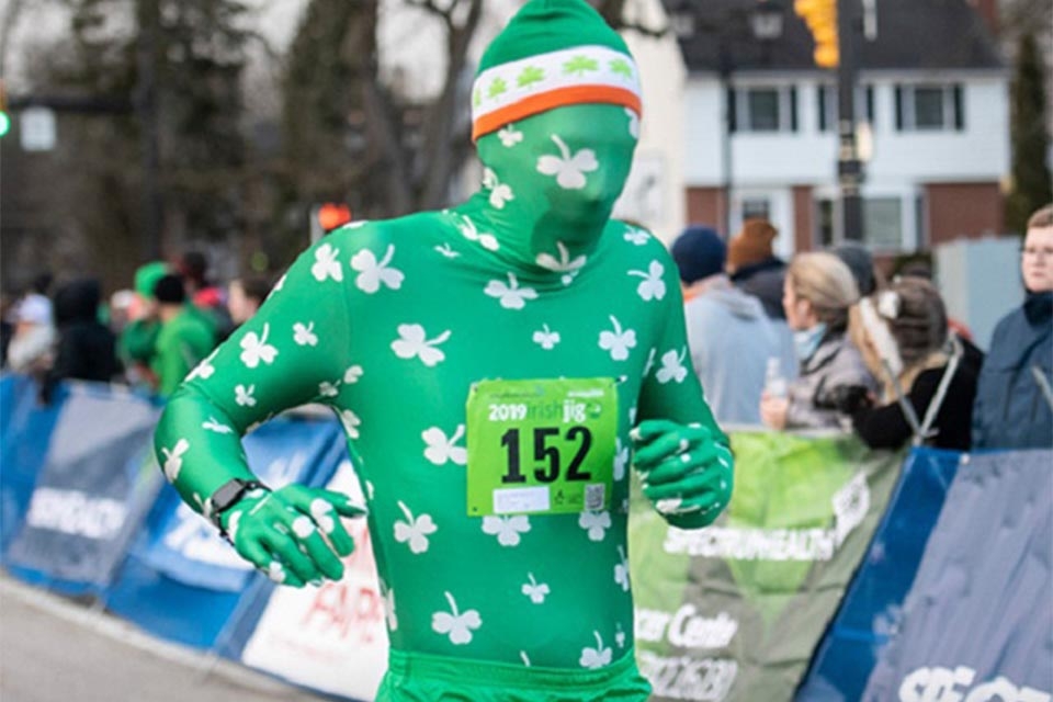 Participant wearing green body suit with shamrocks