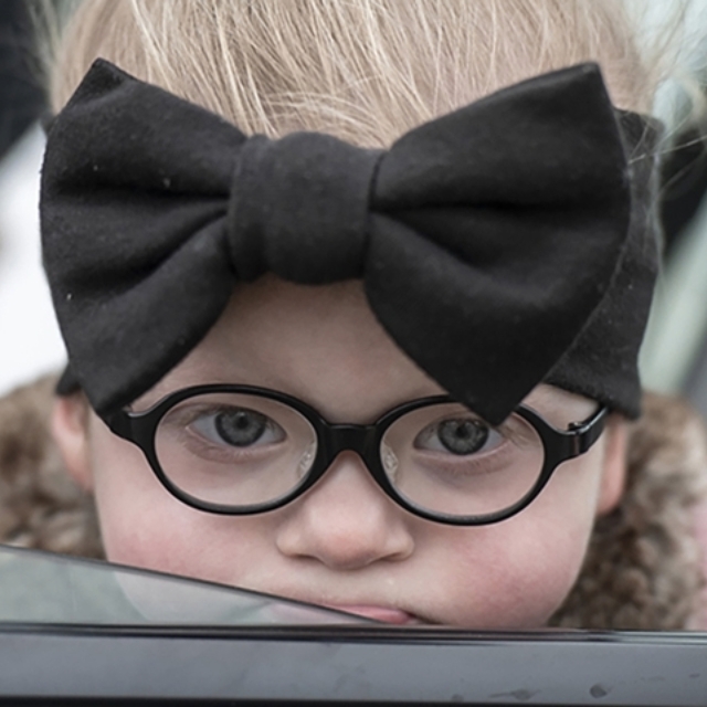 Young girl, wearing glasses.