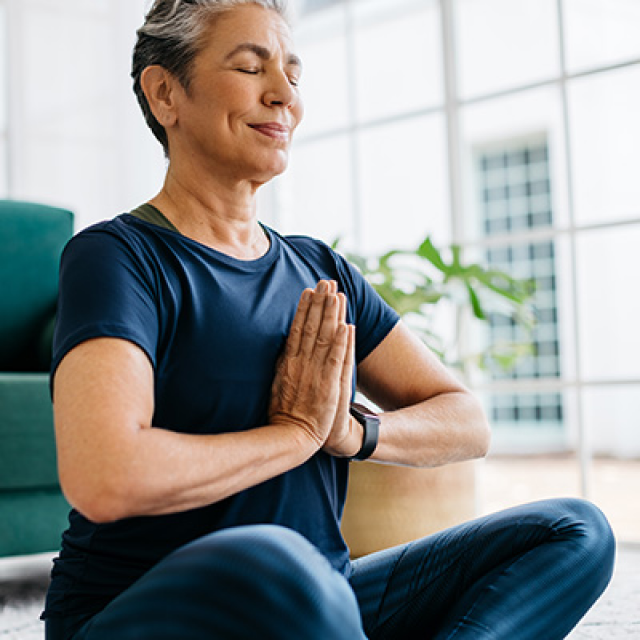 a woman practicing mindfullness for her health and well being