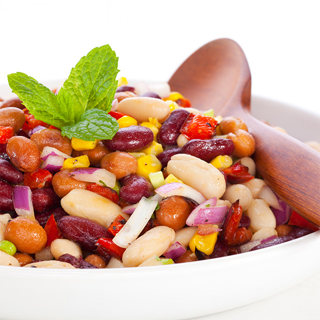 Southwest three-bean salad with mixed beans, corn, peppers and onions, served as a fresh, fiber-rich side dish.