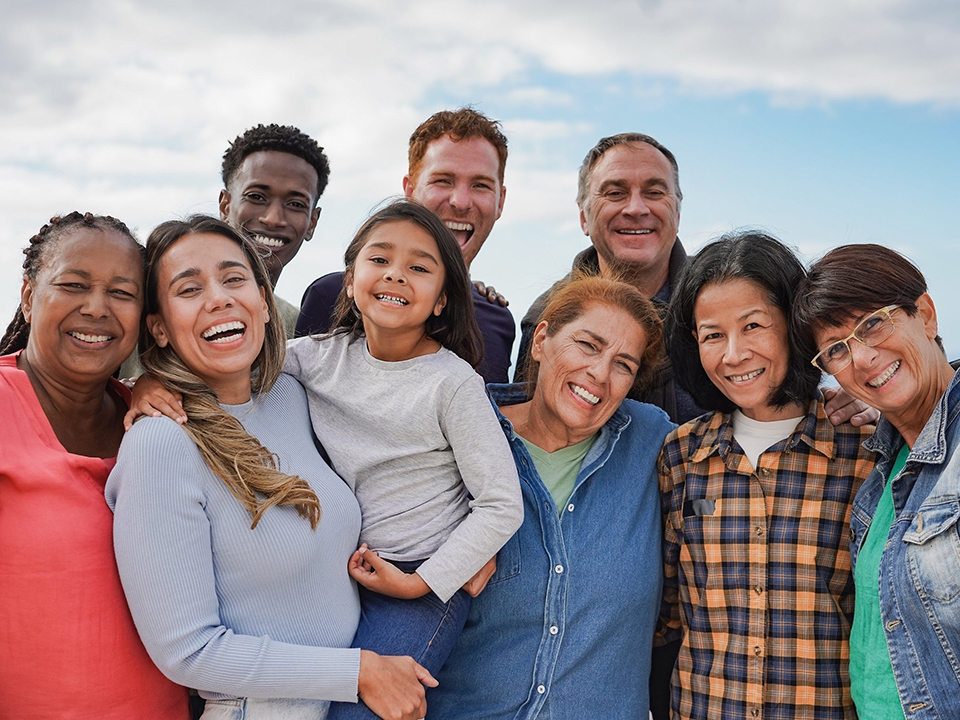 Group of smiling individuals attend community health classes.