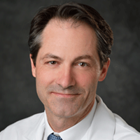 Dr. James M. Klein, MD, alongside Andre Bachmann, PhD, at Michigan State University, focusing on pediatrics and human development.