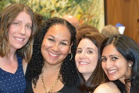 A group of women gathered at a Graduate Medical Education event in Southeast Michigan, showcasing collaboration and support.