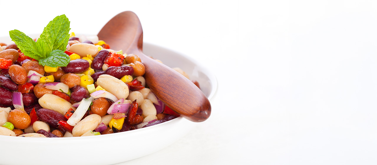 Southwest three-bean salad with mixed beans, corn, peppers and onions, served as a fresh, fiber-rich side dish.