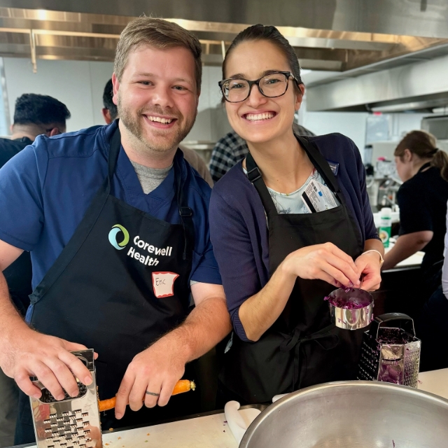 residents participating in a culinary medicine activity by making food