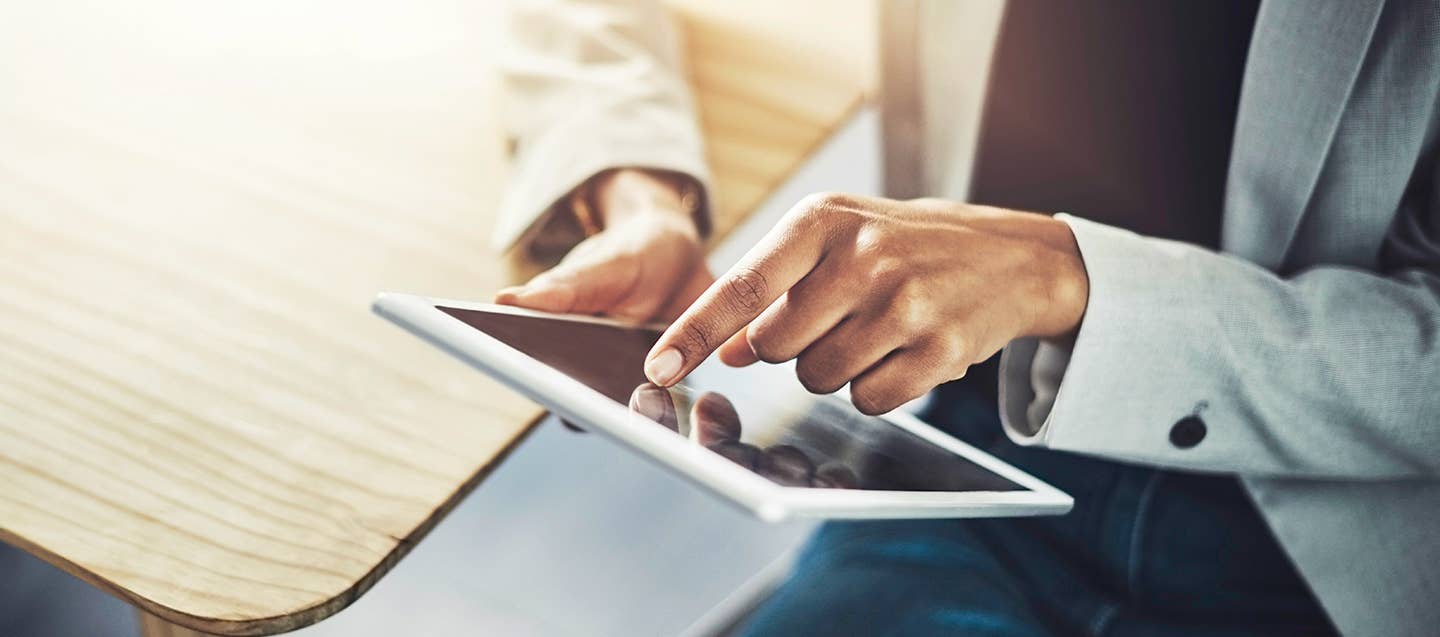 Woman with mobile device uses Corewell Health App to access MyChart