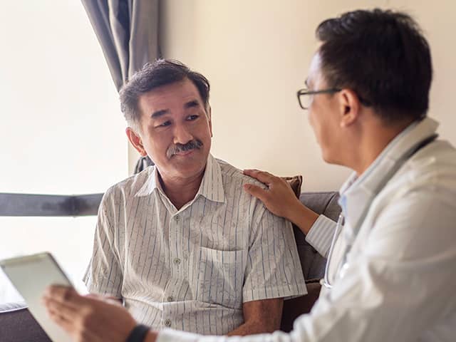 Doctor consulting with a patient, discussing health concerns.