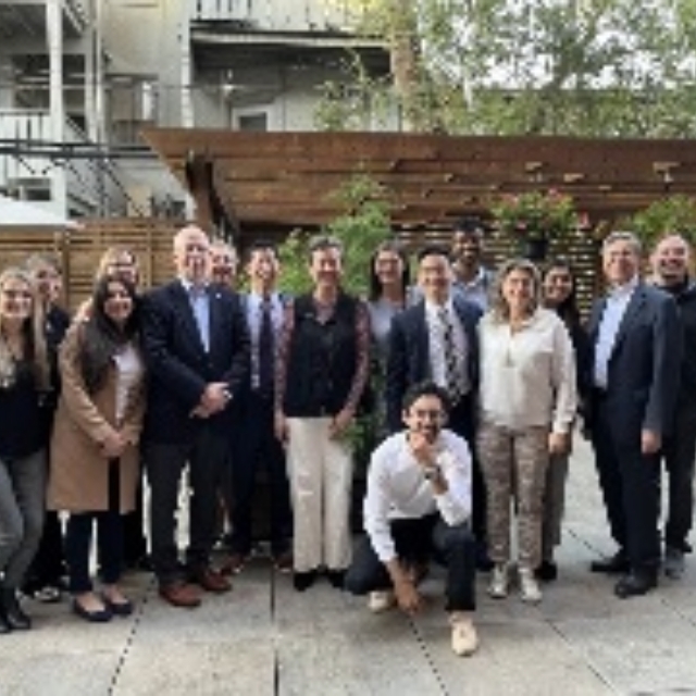 Group photo of staff and residents outside