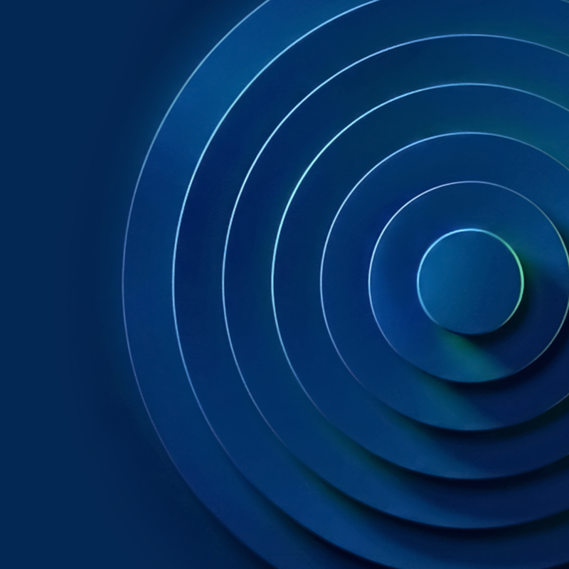 Abstract blue background featuring various circular shapes in different sizes and shades of blue.