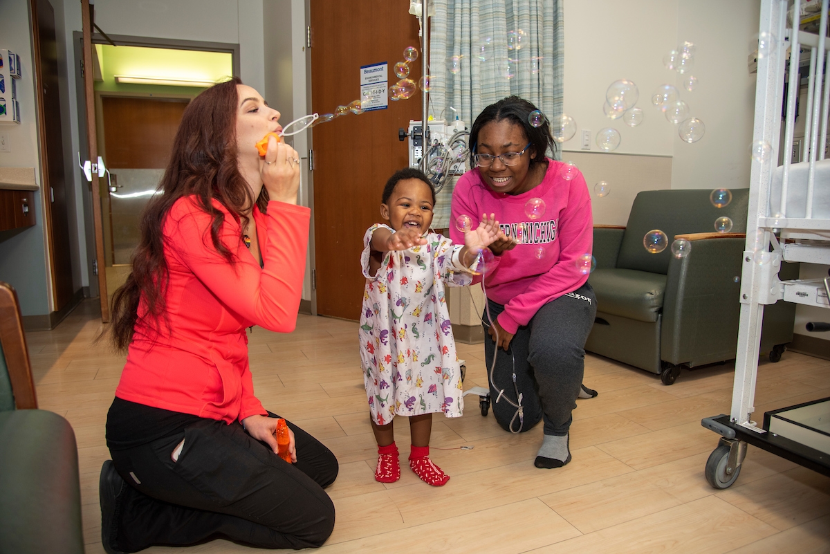 Child being read to in hospital room