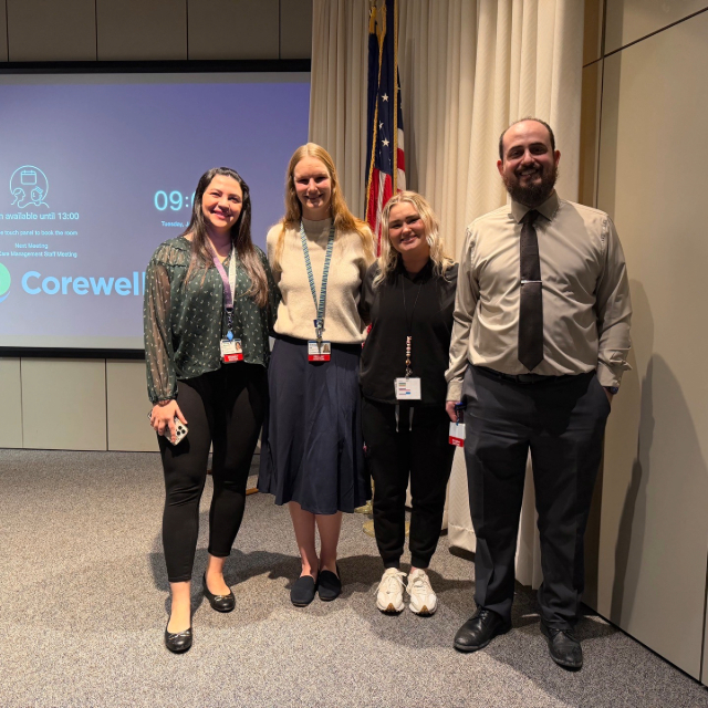Group photo of fellows attending a presentation