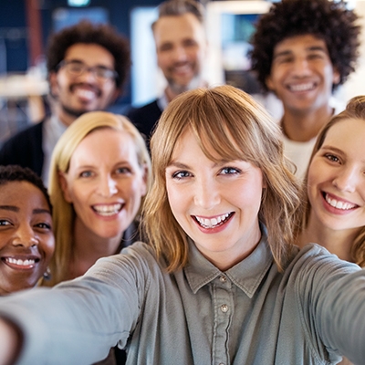 Group of women take photo at selfie station