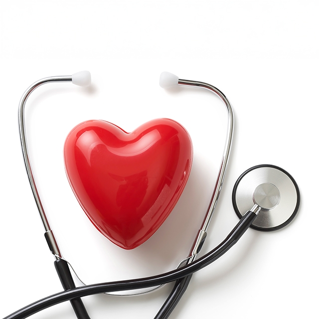 A red heart alongside a stethoscope, set against a white background, symbolizing health and care.