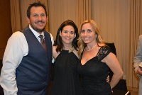 Three individuals pose together for a photo at a Graduate Medical Education event in Southeast Michigan.