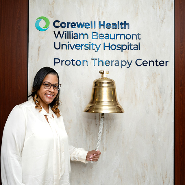 Patient ringing bell at Corwell Health William Beaumont University Hospital Proton Therapy Center.