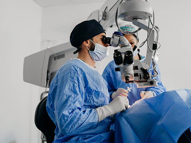 Corewell Health ophthalmology specialist performs surgery on a patient