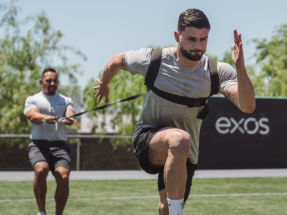 An individual at a fitness facility, emphasizing strength and endurance training.